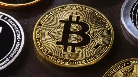 piece de monnaie avec un B inscrit cryptomonnaie